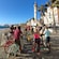 A group of people on bicycles near the seaside in Cadiz, Spain